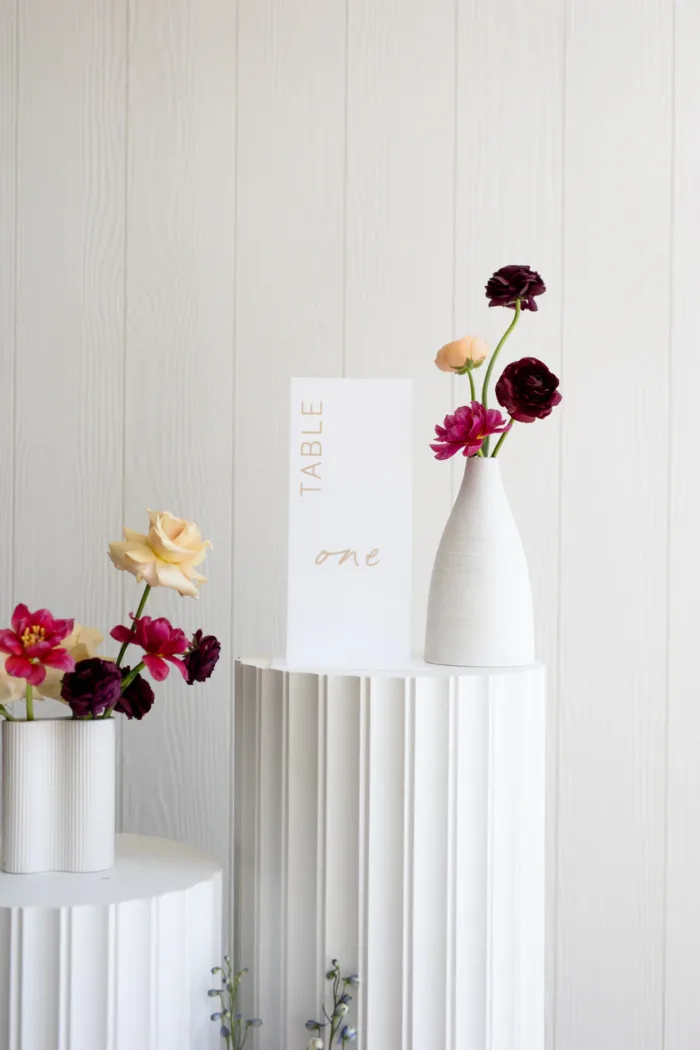White acrylic table number with beige printed text