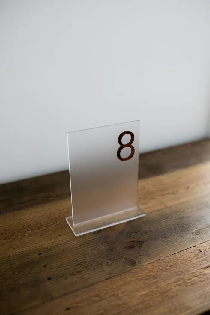 Frosted acrylic table number with copper text