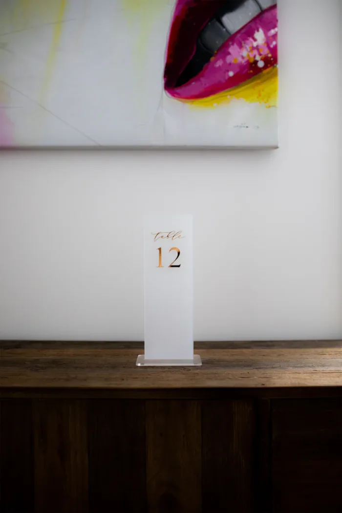 Frosted acrylic table number with gold text